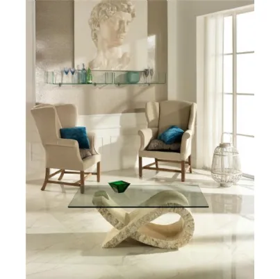 Tavolino Fiocco con base scultorea in pietra fossile e top in vetro temprato di Stones