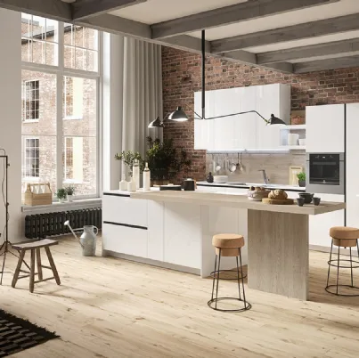 Cucina Design con isola centrale in materico rovere e laccato lucido First di Snaidero