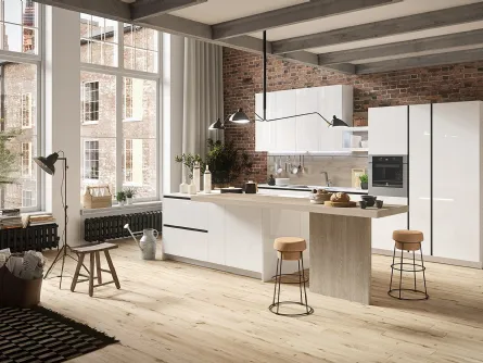 Cucina Design con isola centrale in materico rovere e laccato lucido First di Snaidero